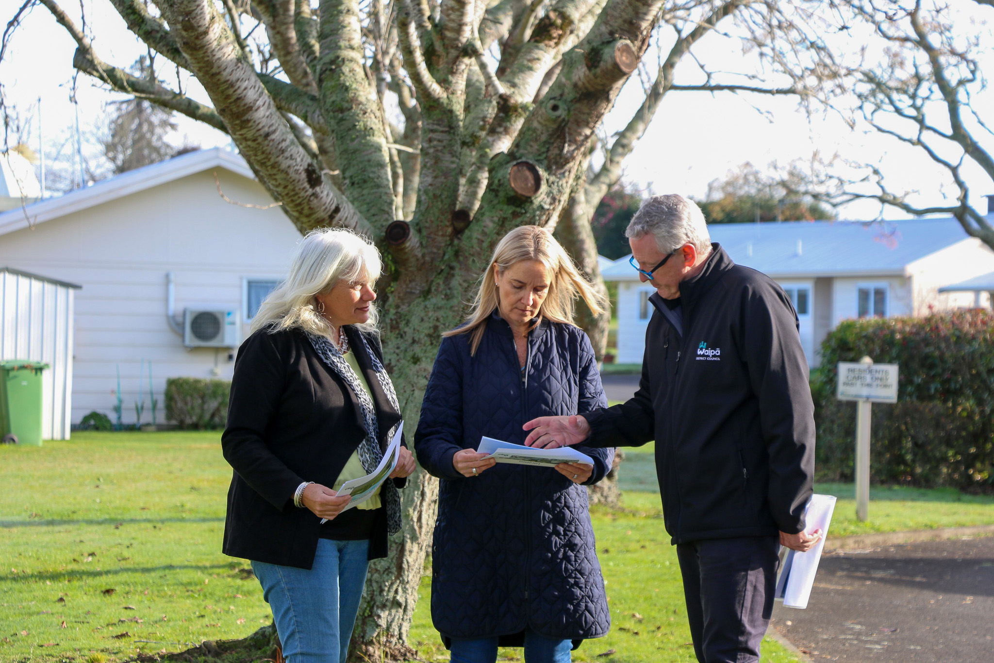 Waipā deputy mayor Liz Stolwyk, mayor Susan O’Regan and property services manager David Varcoe check out plans for 10 new pensioner housing units. 